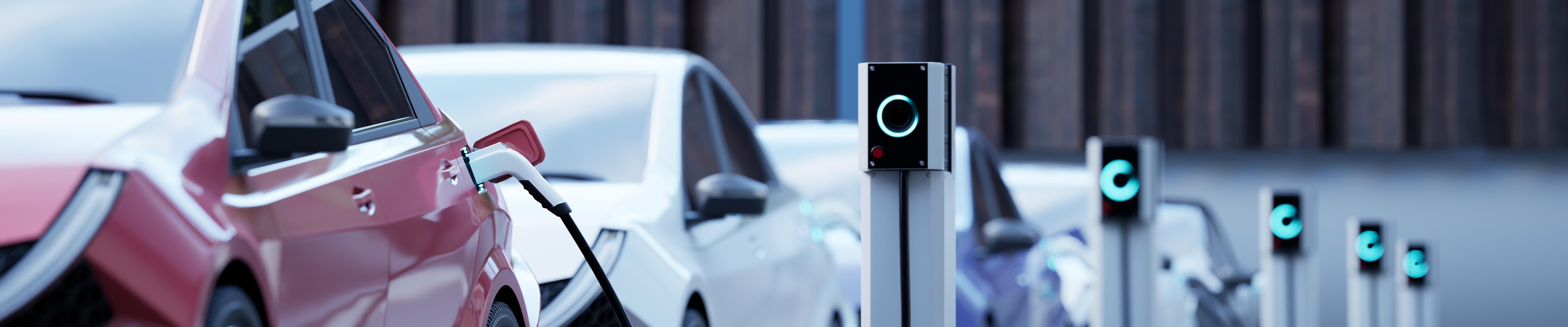 Electric cars charging on a city street.